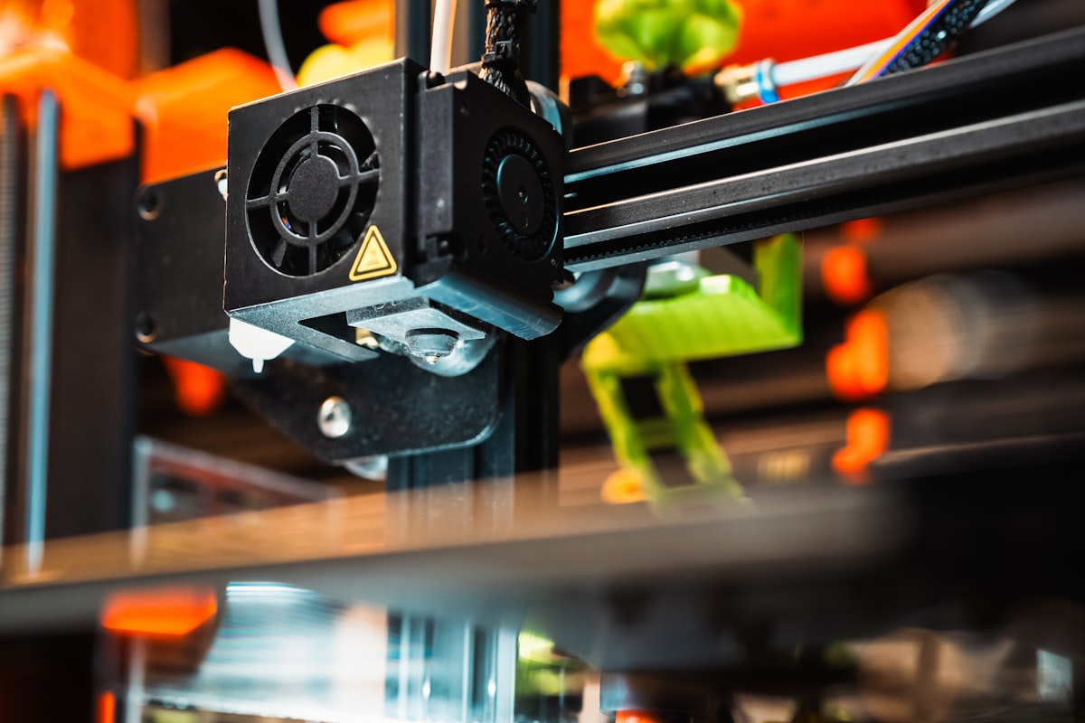 Close-up of 3D printer toolhead and extruder — Bambu X1 Carbon engineering filament printing