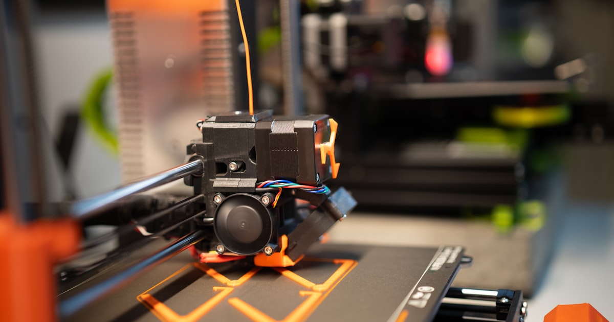 3D printer extruding filament close-up — outdoor-ready filament guide for Bambu Lab