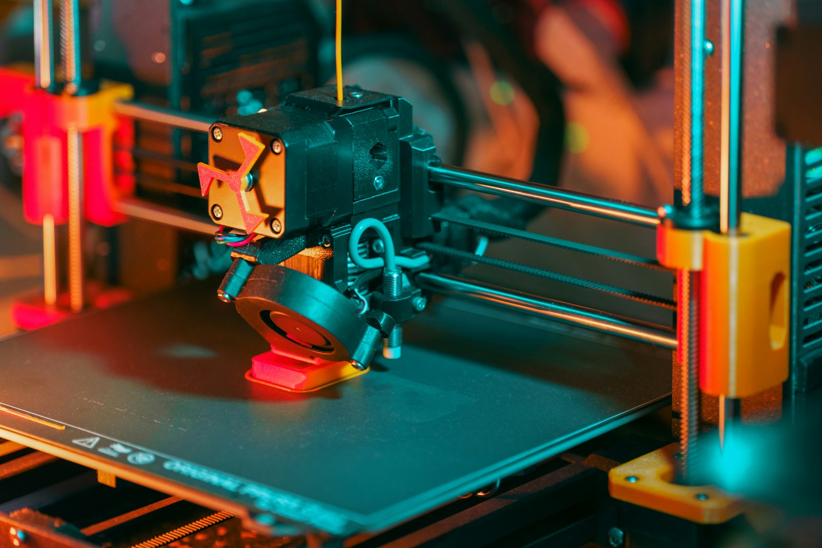PLA stringing causes and fixes — 3D printer laying down bright PLA filament